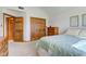 Comfortable bedroom featuring a large closet, hardwood doors, and neutral colored carpet at 2274 W Huntsville Rd, Pendleton, IN 46064