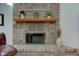 Close up shot of a brick fireplace with decorative accents, and a glassed in firebox at 2274 W Huntsville Rd, Pendleton, IN 46064
