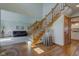Inviting foyer with hardwood floors, staircase and views to the living room at 2274 W Huntsville Rd, Pendleton, IN 46064