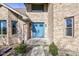 Charming blue double-door front entry with well-manicured landscaping at 2274 W Huntsville Rd, Pendleton, IN 46064