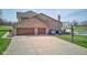 Attached two-car garage and basketball court area with a pool view at 2274 W Huntsville Rd, Pendleton, IN 46064