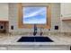 Close-up of the kitchen sink featuring granite countertops and modern fixtures at 2274 W Huntsville Rd, Pendleton, IN 46064