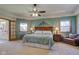 Tranquil main bedroom with a ceiling fan, soft carpet, and access to ensuite bathroom at 2274 W Huntsville Rd, Pendleton, IN 46064