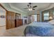 Large main bedroom with a ceiling fan, soft carpet, and ensuite bathroom at 2274 W Huntsville Rd, Pendleton, IN 46064