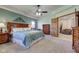 Main bedroom featuring soft carpet, sitting area, and ensuite bathroom at 2274 W Huntsville Rd, Pendleton, IN 46064