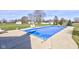 Backyard featuring a covered pool surrounded by a concrete patio, grass, and mature trees at 2274 W Huntsville Rd, Pendleton, IN 46064