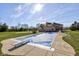 Spacious backyard with a covered pool, diving board, lush lawn, and brick house for outdoor enjoyment at 2274 W Huntsville Rd, Pendleton, IN 46064