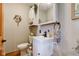 Charming powder room with stylish vanity, floral accents, and ample storage space at 2274 W Huntsville Rd, Pendleton, IN 46064