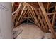 Unfinished attic space with wooden beams and plywood flooring at 2326 Saddle Dr, Shelbyville, IN 46176