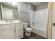 Bathroom featuring modern vanity, mirror, and shower with white walls and wood look floor at 2326 Saddle Dr, Shelbyville, IN 46176