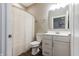 Well-lit bathroom with modern fixtures, stylish vanity, and a shower with a curtain at 2326 Saddle Dr, Shelbyville, IN 46176
