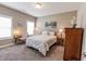 Cozy bedroom with a plush bed, desk, neutral walls and ample natural light at 2326 Saddle Dr, Shelbyville, IN 46176