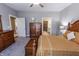 Comfortable carpeted bedroom with natural light and wooden furniture sets a welcoming tone at 2326 Saddle Dr, Shelbyville, IN 46176