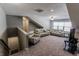 Spacious bonus room with comfortable seating, neutral colors, and a relaxing atmosphere at 2326 Saddle Dr, Shelbyville, IN 46176