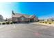 Community clubhouse with brick facade, arched windows, and ample parking available at 2326 Saddle Dr, Shelbyville, IN 46176