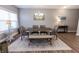 Cozy dining room with hardwood floors, a chandelier, and a farmhouse-style table at 2326 Saddle Dr, Shelbyville, IN 46176
