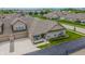 Charming brick townhome with an attached garage and a cozy front porch sitting area at 2326 Saddle Dr, Shelbyville, IN 46176