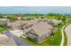 A collection of tan brick townhomes with attached garages and well-manicured green lawns at 2326 Saddle Dr, Shelbyville, IN 46176