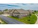 Attractive single-story brick home with well-maintained landscaping and a paved driveway at 2326 Saddle Dr, Shelbyville, IN 46176