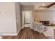 Hallway with hardwood floors, a neutral color palette, and easy access to the bathroom at 2326 Saddle Dr, Shelbyville, IN 46176