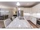 Open kitchen featuring granite countertops, stainless steel appliances, and a center island with seating, perfect for entertaining at 2326 Saddle Dr, Shelbyville, IN 46176