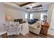 Cozy living room features decorative wood beams, ample natural light, and comfortable seating, perfect for relaxation at 2326 Saddle Dr, Shelbyville, IN 46176