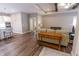 Open-concept living room with modern decor, hardwood floors, and seamless flow to adjacent kitchen area at 2326 Saddle Dr, Shelbyville, IN 46176