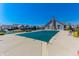 Covered community pool with a large deck area with neighborhood homes in the background at 2326 Saddle Dr, Shelbyville, IN 46176