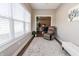 Cozy sun room featuring large windows, a comfortable recliner, and natural light at 2326 Saddle Dr, Shelbyville, IN 46176