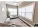 Bright sun room featuring large windows, neutral paint colors, and plush seating at 2326 Saddle Dr, Shelbyville, IN 46176