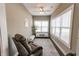 Sun-filled room with a ceiling fan, large windows, and seating area for relaxation at 2326 Saddle Dr, Shelbyville, IN 46176