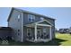Exterior of home with a covered porch featuring comfortable patio seating at 2882 Simsbury Ln, Brownsburg, IN 46112
