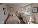 Pink bedroom with twin beds, ballerina art, and a shared nightstand at 2882 Simsbury Ln, Brownsburg, IN 46112