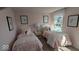 Pink bedroom featuring two twin beds with pink accents and matching decor at 2882 Simsbury Ln, Brownsburg, IN 46112