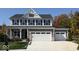 Beautiful two-story home featuring a 2-car garage, gray siding, black shutters and a covered front porch at 2882 Simsbury Ln, Brownsburg, IN 46112
