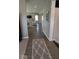 Entryway hallway showcasing the smooth transition to a living area and stairs going to the second floor at 2882 Simsbury Ln, Brownsburg, IN 46112