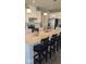 Bright kitchen boasts a large center island with seating, stainless steel appliances, and pendant lighting at 2882 Simsbury Ln, Brownsburg, IN 46112