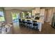 Open-concept kitchen with island seating flows into the living area and features stainless steel appliances at 2882 Simsbury Ln, Brownsburg, IN 46112