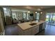 Inviting open-concept space with kitchen island, cozy living area, and sliding doors leading to outdoor space at 2882 Simsbury Ln, Brownsburg, IN 46112
