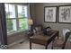 Home office with natural light, desk, chair, and decorative artwork provides a perfect workspace at 2882 Simsbury Ln, Brownsburg, IN 46112
