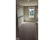 Spacious walk-in closet with window, neutral carpet and walls, and wire shelving system at 2882 Simsbury Ln, Brownsburg, IN 46112