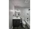 Stylish bathroom with white marble-style tiled shower, modern fixtures, and dark vanity at 3262 Orchard Ave, Indianapolis, IN 46218