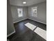 Bright bedroom featuring laminate flooring, neutral paint, and ample natural light at 3262 Orchard Ave, Indianapolis, IN 46218