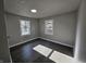 This bedroom features wood-look floors, neutral paint, and natural light at 3262 Orchard Ave, Indianapolis, IN 46218