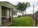 This home features a screened-in porch, a well maintained lawn and mature trees in the backyard at 3335 Woodcrest Ct, Columbus, IN 47203