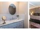 Bathroom featuring a sink, mirror and modern design at 3335 Woodcrest Ct, Columbus, IN 47203