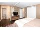 Bedroom with TV, two closets, and connected bathroom at 3335 Woodcrest Ct, Columbus, IN 47203