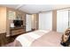 Bedroom with TV, two closets, and connected bathroom at 3335 Woodcrest Ct, Columbus, IN 47203
