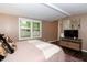 Bedroom with TV, two closets, and connected bathroom at 3335 Woodcrest Ct, Columbus, IN 47203