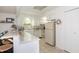 Bright kitchen with white cabinets, stainless appliances, and an island with seating at 3335 Woodcrest Ct, Columbus, IN 47203